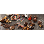 Assorted chocolate truffles and candy-coated chocolates on a dark surface.
