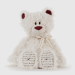 White plush teddy bear with red accents and a ribbon bow