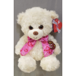 White teddy bear with a pink heart-pattern ribbon