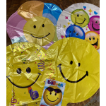 Assorted smiley-face balloons in bright colors