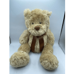 Plush teddy bear with a brown ribbon bow