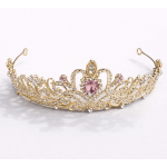 Gold tiara with pink and clear rhinestones on a white background