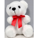 White plush teddy bear with a red ribbon bow