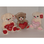 Three teddy bears holding heart-shaped pillows with love messages