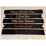 Black satin ribbons with Valentine’s Day messages in gold and red lettering
