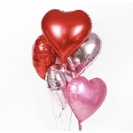 Cluster of heart-shaped red, pink, and silver balloons