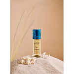 Bottle of LAFCO New York Bare Summer perfume on sand with seashells