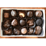 Rectangular box of assorted chocolates arranged in dark paper cups