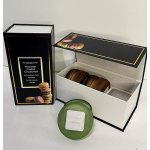 Macaron-themed candle gift set with round jar candles in a black and white presentation box.