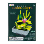Boxed block succulent toy set with bright green plants and a pink flower in a gray planter