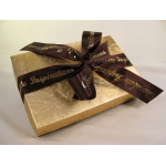 Gold gift box tied with a dark ribbon