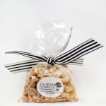 Bag of mixed nuts tied with a striped ribbon