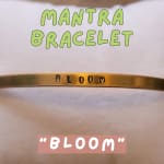 Gold bracelet engraved with the word Bloom