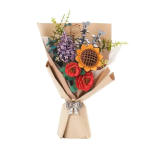 Paper bouquet with colorful layered flowers and a ribbon tie