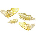 Four gold decorative butterfly ornaments on a white background