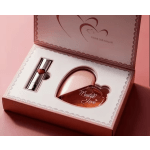 Pink gift box with a heart-shaped perfume bottle and lipstick