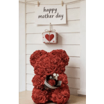 Red rose teddy bear with a small gift box and Mother’s Day sign