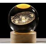Glass orb with a glowing solar system design on a pedestal