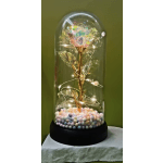 Decorative glass dome with a single iridescent rose and pastel beads