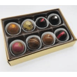Box of assorted chocolates in paper cups