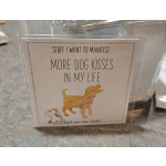 A dog-themed card in a clear plastic sleeve with a small bone charm
