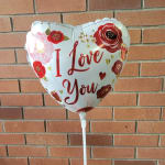 Heart-shaped balloon with "I Love You" text and floral graphics