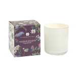 White glass jar candle beside a floral-printed Maison Bloom box