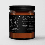 Amber candle in a black-lidded jar with an Aquarius label