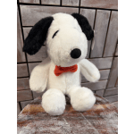 Plush Snoopy toy with a red bow tie