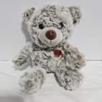 Plush teddy bear with a red heart on its chest