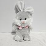 Gray plush bunny with white ears and a pink bow tie
