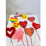 Assorted Valentine’s Day heart and emoji pick decorations on sticks
