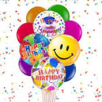 Cluster of colorful birthday balloons with confetti background