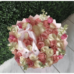 Bouquet of pink and cream roses with tulips and a satin ribbon