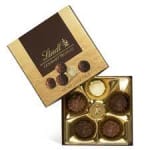Box of assorted chocolates in gold and brown packaging