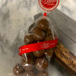 Bag of chocolate candies with a red branded label