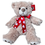 Plush teddy bear with a red heart-pattern ribbon