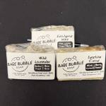 Three wrapped bars of soap labeled Bare Bubble