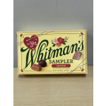 Box of Whitman's assorted chocolates with a heart tag