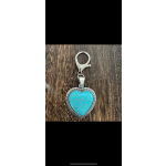 Heart-shaped turquoise keychain charm on a wood surface