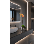 Potted orchid with orange blooms in a silver container on a countertop