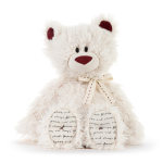 White teddy bear with red accents and a ribbon bow