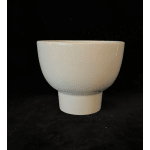 White ceramic planter pot on a black background