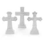Three white decorative crosses with ornate carved details