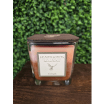 Square glass candle jar with a wooden lid and orange wax