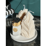 Decorative leaf-shaped candles with a box of matches
