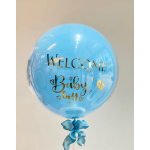 Blue balloon with gold "Welcome Baby Boy" text and a ribbon bow