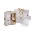 Gift set with a plush giraffe toy, blanket, and matching bag