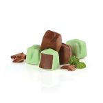 Assorted green and brown chocolate candies with mint leaves