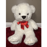 White teddy bear with a red ribbon bow